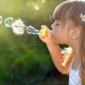 Blowing soap bubbles